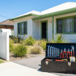 Australian home with professional toolbox showing plumbing electrical tools for common home maintenance problems after summer holiday